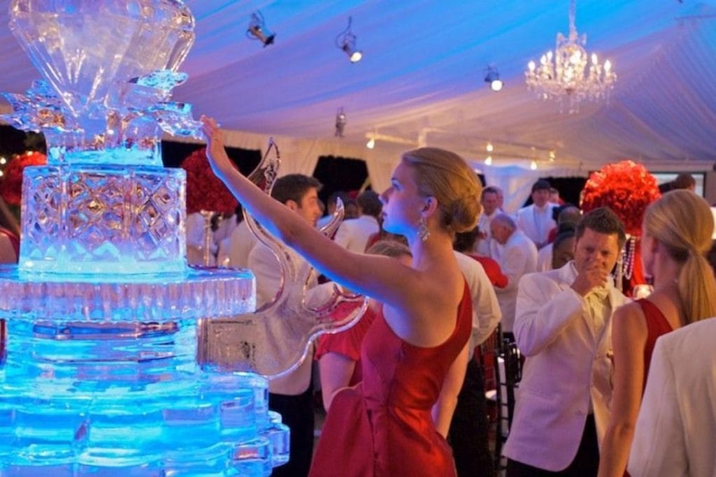 Elegant event setup with floral centerpieces and ambient lighting, showcasing event planning Jacksonville FL expertise.