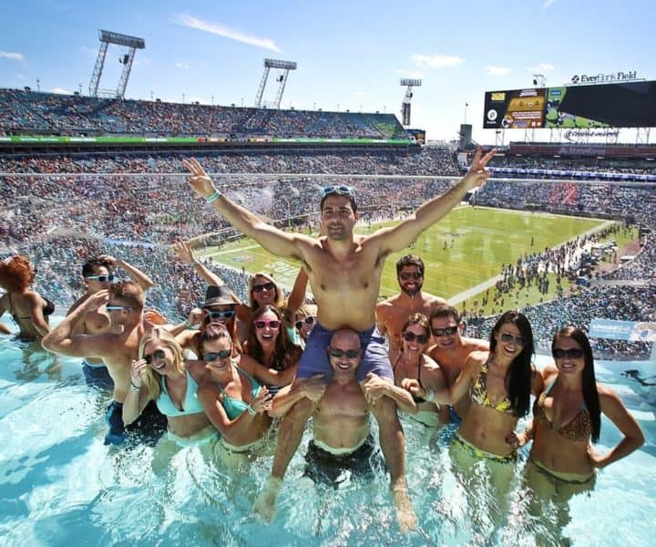 Elegant event setup with floral centerpieces and string lights, ideal for event planning Jacksonville FL.