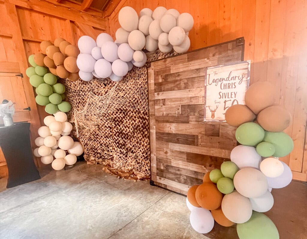 Group of people celebrating at an outdoor event, organized by Jacksonville Party Company event planning, with festive decorat