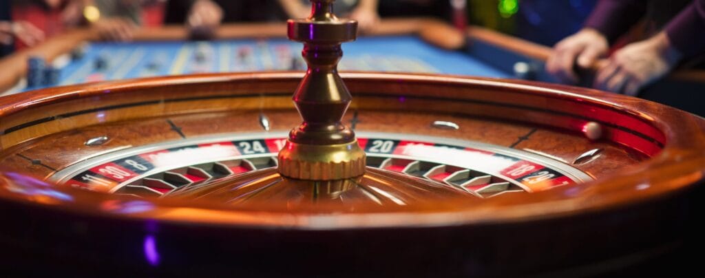 Close-up of a spinning roulette wheel with the ball landing on a number, showcasing the excitement of casino games.