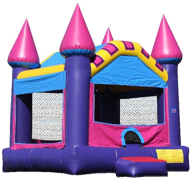 Purple castle bounce house with turrets and slide, set up outdoors on grass, ideal for children's parties.