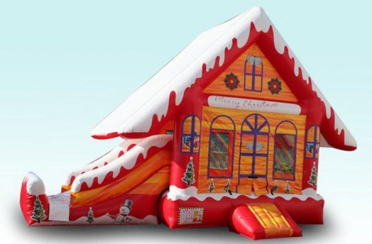 Festive Christmas-themed inflatable bouncer with snowflakes and holiday decorations, ideal for holiday parties and events.